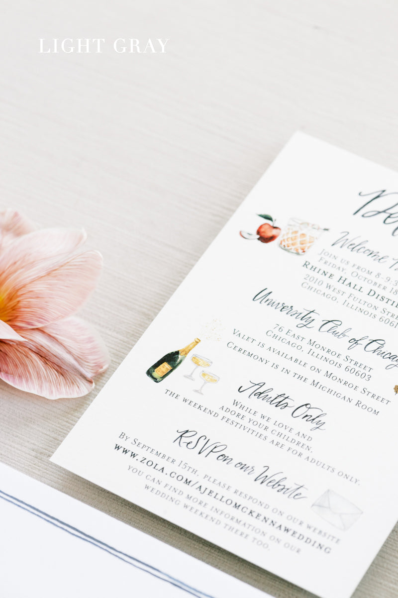 Close up of light gray velvet styling mat with wedding detail paper